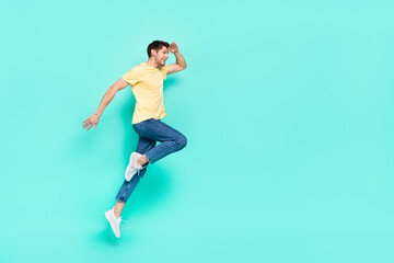 Full body profile photo of active person hand forehead look empty space isolated on turquoise color background