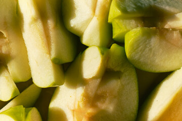 Sliced into quarters juicy green apples top view. Horizontal banner with summer fruits. Autumn and late summer harvest. The concept of healthy eating.