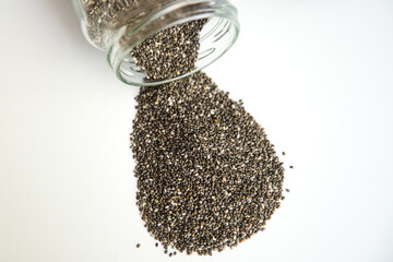 Pile of edible chia seeds from the Salvia hispanica plant. Very healthy functional food to use in...