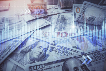 Multi exposure of forex chart drawing over us dollars bill background. Concept of financial success markets.