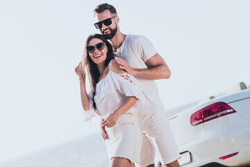 Photo of charming pretty boyfriend girlfriend dressed casual outfit embracing driving cabriolet...