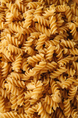 Traditional Italian fusilli pasta. Dry uncooked pasta.