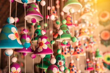 Clay bells hanging in a craft store in La Paz Centro Nicaragua. Concept of travel memories in tourist cities and magical towns