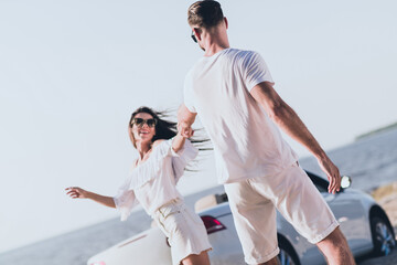Photo of dreamy carefree husband wife wear casual clothes riding cabriolet dancing outside...