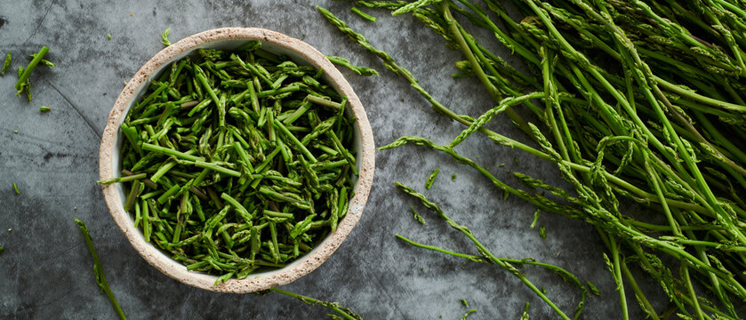 cut wild asparagus in a bowl, web banner