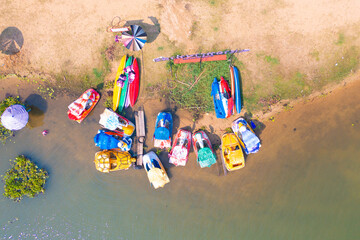 Aerial top view of boats with lake or river