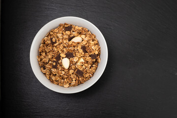 muesli with nuts and chocolate in th bowl