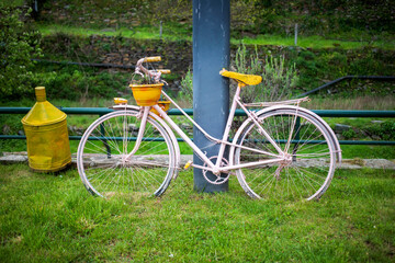 Fototapeta na wymiar blue decorative bicycle on the street of village