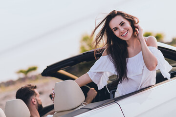 Photo of charming cute boyfriend girlfriend dressed casual outfit going honeymoon driving cabriolet...