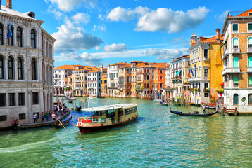 Scenic view of the Grand Canal, floating boats and gondolas in Venice