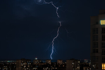 lightning in the night sky over the city