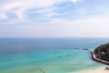 Distant view of mountain of island. Nature landscape view of beautiful tropical beach and sea in sunny day. White beach sea space area blue waters and sunny skies were beautiful with many small boats.