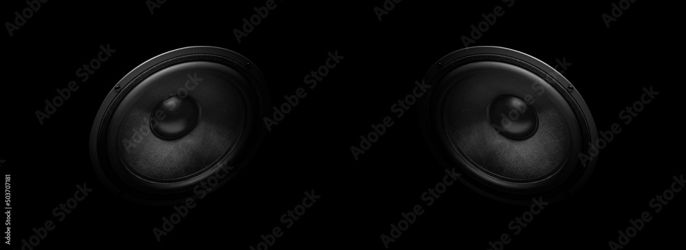 Wall mural a pair of modern powerful sound speakers on a dark background.