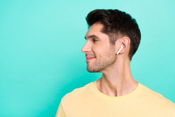 Profile photo of funny brunet young guy look promo wear t-shirt headphones isolated on teal color background