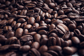 Roasted coffee beans background. Selective focus