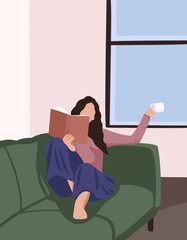 the girl lies on a green sofa with a book in her hands.  Bright cozy room