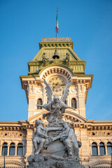 Fototapeta na wymiar Fountain of the Four Continents in Trieste, in front of the Town, Piazza Unità d'Italia
