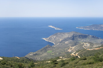 Fototapeta premium Top view at beautiful blue Mediterranean sea peninsula in summer in town of Kalkan, Turkey.Natural background.Beauty in nature concept.Copy space