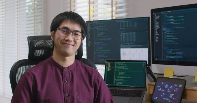 Digital transformation future workforce web DEV career. Asia people young talent man relax smile look at camera remote work at home office reskill upskill job on AI cloud computing cyber security.