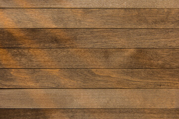 Obraz premium Wooden surface as background texture with rays of light.