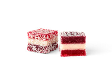 Fruit color marmalade with cherry flavor and sprinkled coconut isolated on white background.