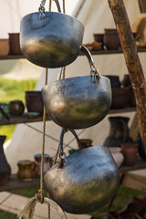 metal utensils for a fire on a wooden shelf