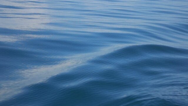 Slow motion of wave sea splashing inside boat