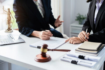Law, Consultation, Agreement, Contract, Attorney or Lawyer holding a pen is consulting with a client to explain the pattern of answering questions before going to court to decide a lawsuit.