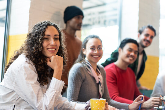 University Students Multiethnic Team Studying Together  On A New Project In Creative Coworking Classroom - University Concept - Bright Filter With Focus On First Woman On Left