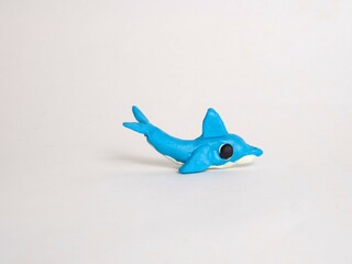 Plasticine craft blue dolphin. Sculpting for children, development of motor skills. Marine life