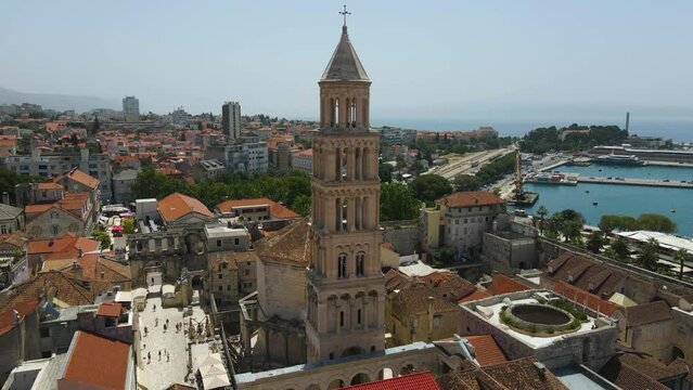 Aerial drone rotating shot of Diocletian's Palace, the bell tower of the cathedral of St Domnius in Split city centre. Diocletian's palace visible in Dalmatia, Croatia.