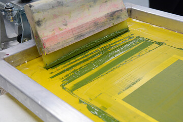 Screen printing squeegee in ink for printing t-shirts or posters