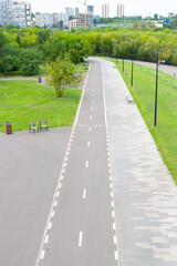 Summer landscape with empty pedestrian and bicycle paths in the city park. Top view