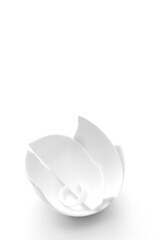 Broken white cup on a white background. Vertical. Concept of carelessness. Copy space. Place for text.