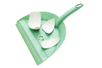 Dustpan with a broken cup on white background. Dustpan green color. Isolated. Clipping path. House cleaning.