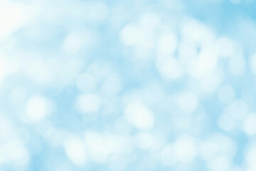 Abstract blurred blue background with light bokeh