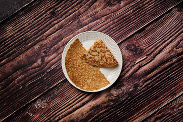 Taken from above flat lay picture of a pancake half & quarter.