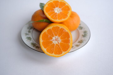 ripe and juicy tangerine (mandarin). cutaway tangerine fruit on a white background.