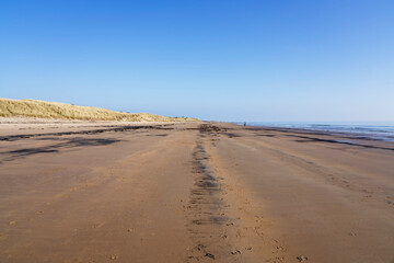 A blue sky spring morning on East Chevington Bay beach in Northumberland