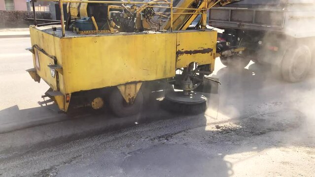 The sweeper cleans the asphalt. cleaning city streets. utility vehicles