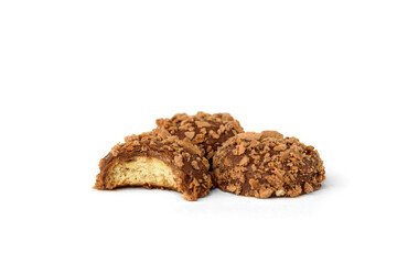 Shortbread cookies in milk chocolate glaze and crumbs isolated on white background.