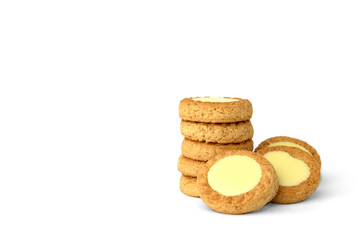 Round shortbread cookies with lemon filling isolated on white background.