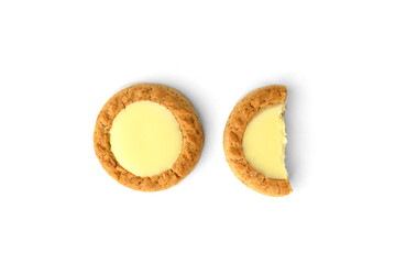 Round shortbread cookies with lemon filling isolated on white background.