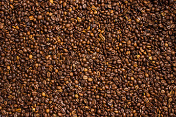 Coffee beans in full screen. Wallpaper from coffee beans. Texture of coffee beans