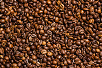 Coffee beans in full screen. Wallpaper from coffee beans. Texture of coffee beans