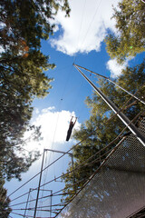 One Swinging Trapeze Artist Performing Outside