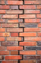 Vintage brick wall with a crack. Textured background. Copy space. 