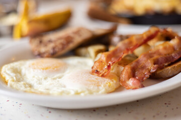 Delicious Morning Breakfast Plate of Eggs, Bacon and Sausage.