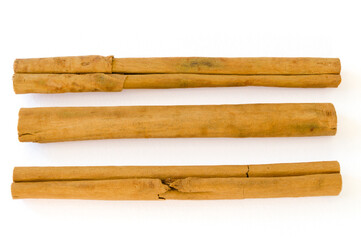 Rolled dry cinnamon isolated on a white background