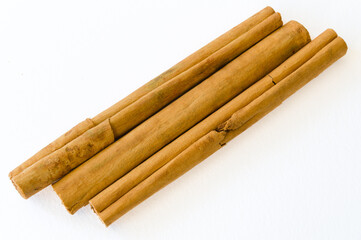 Rolled dry cinnamon isolated on a white background